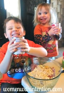 The kids love to help make the meatballs.  Here they are shaking up the evaporated milk before we added it to the ground beef!